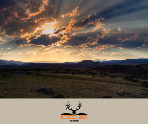 Wide open spaces of Wyoming. A beautiful sunrise with sun rays coming through the clouds.