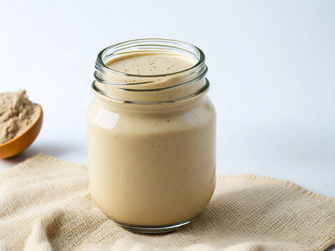 Creamy Tahini sauce in a jar.
