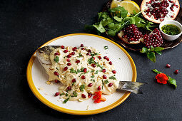 Savor the succulent flavors of marinated fish bathed in tantalizing tahini sauce.