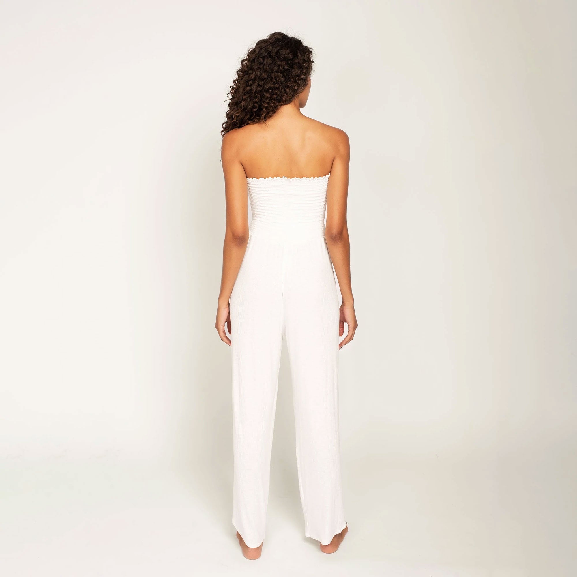 white ribbed strapless jumpsuit with side slits