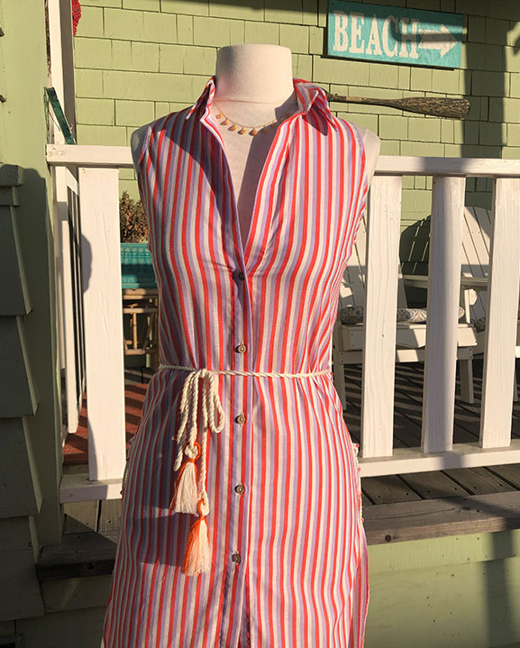 orange and purple striped button down dress on mannequin