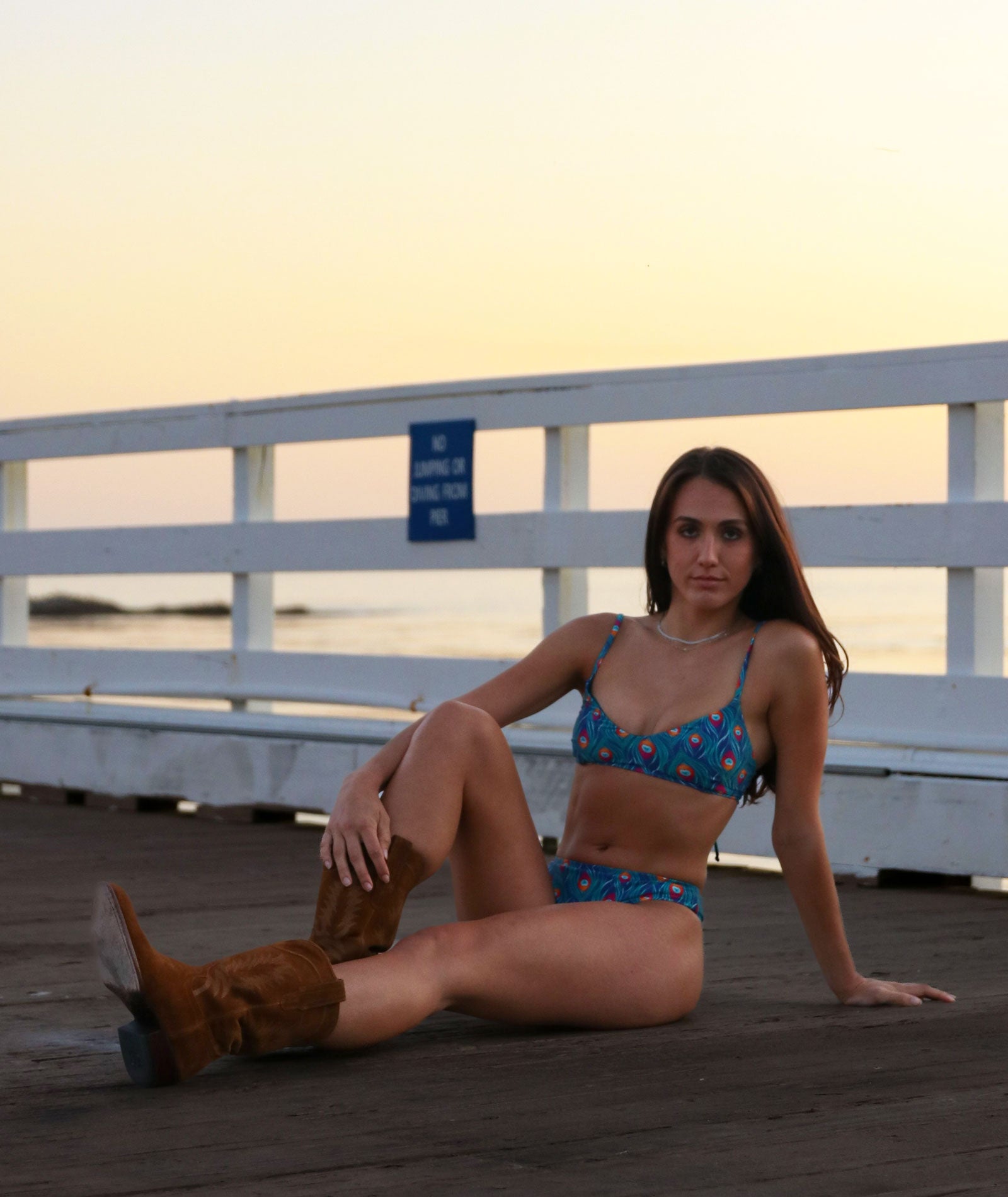 model wearing peacock print bikini