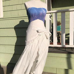 white tie front wrap skirt on mannequin with blue strapless crop top