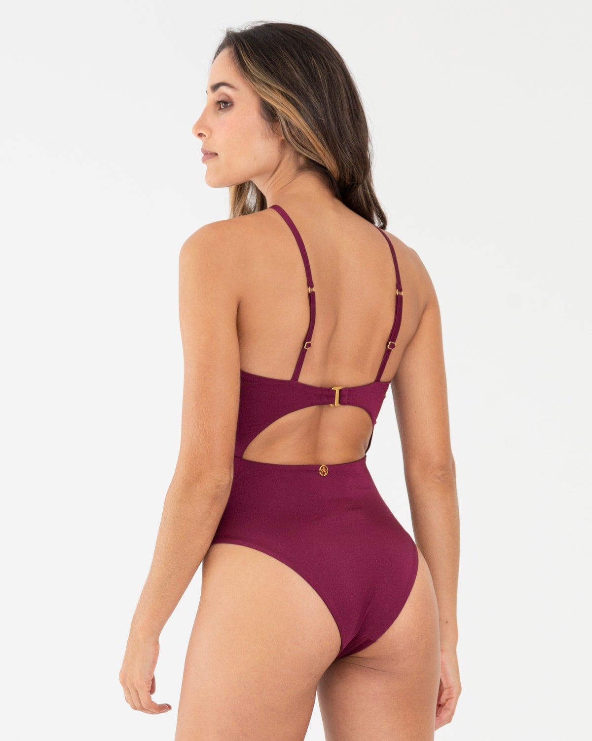 Wine colored one piece with cutout back and adjustable straps.