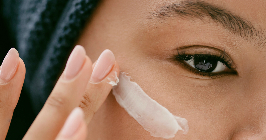 woman applying eye cream