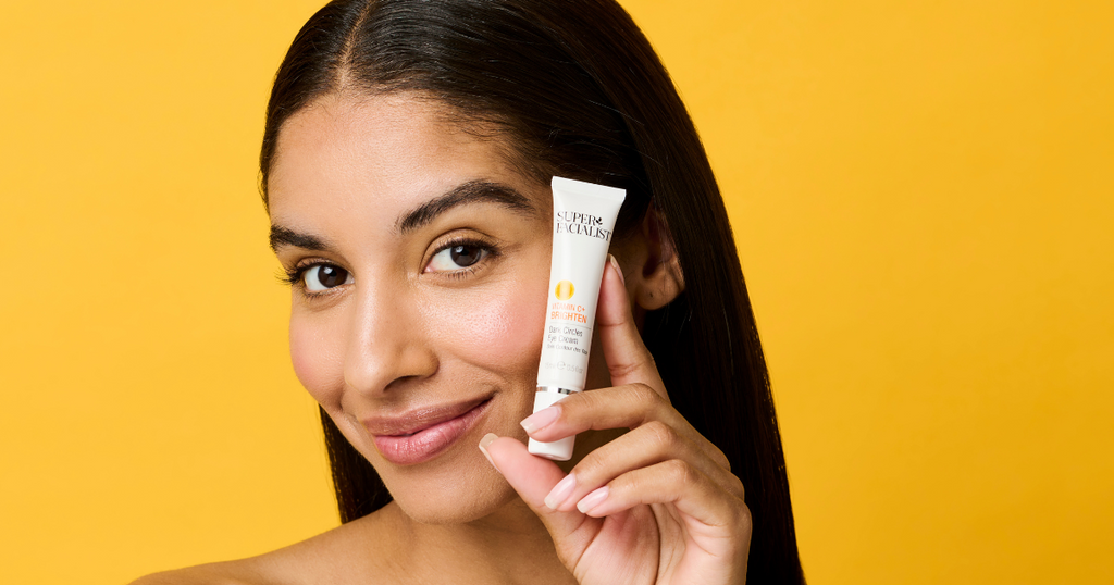 model-holding-vitamin-c-eye-cream