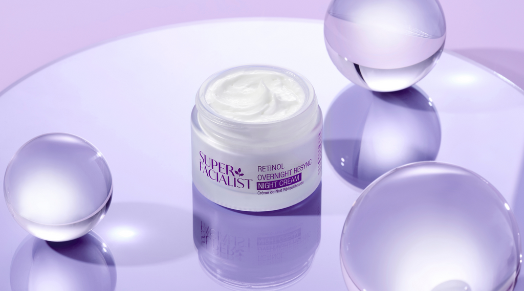 retinol jar cream on purple glass background