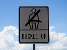 Buckle up road sign