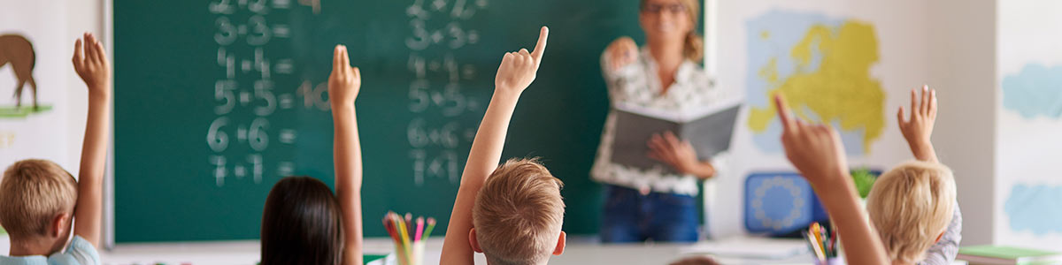 Maths Teacher in Classroom with Students