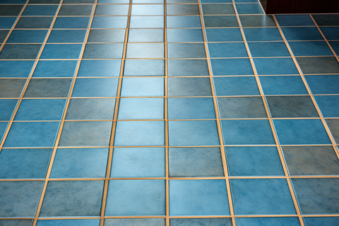 blue tiles with yellow sanded-grout 