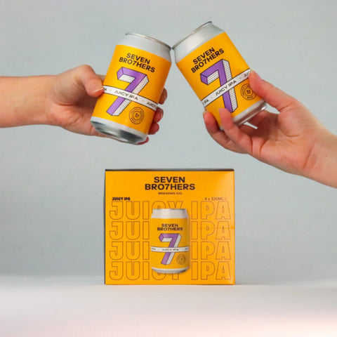 2 cans of Juicy IPA above a four pack.