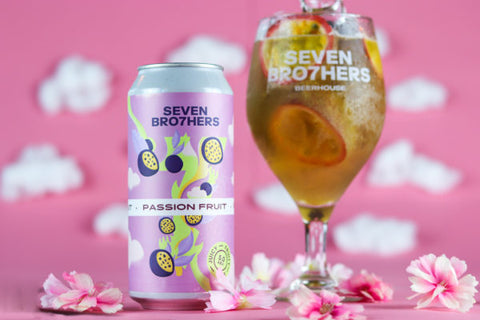 A can of Passion Fruit Pale with a glass poured next to it.