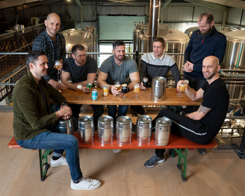 A photo of the seven brothers at the brewery.