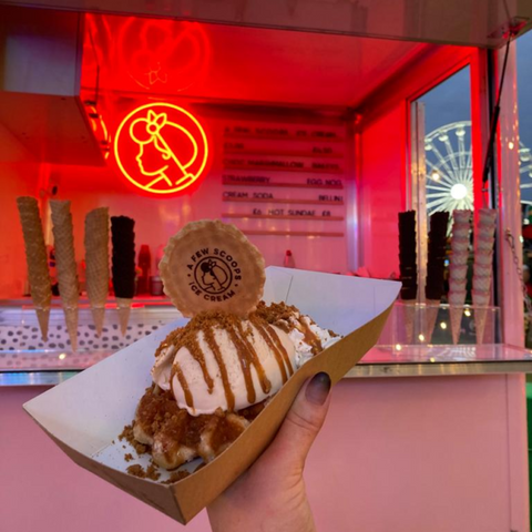 A photo of waffles and ice cream from a few scoops.