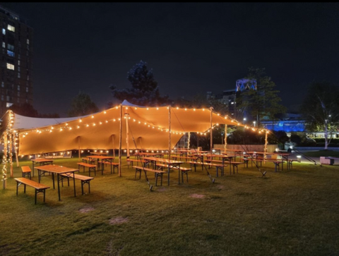 Outdoor seating our Media City bar underneath a tent.