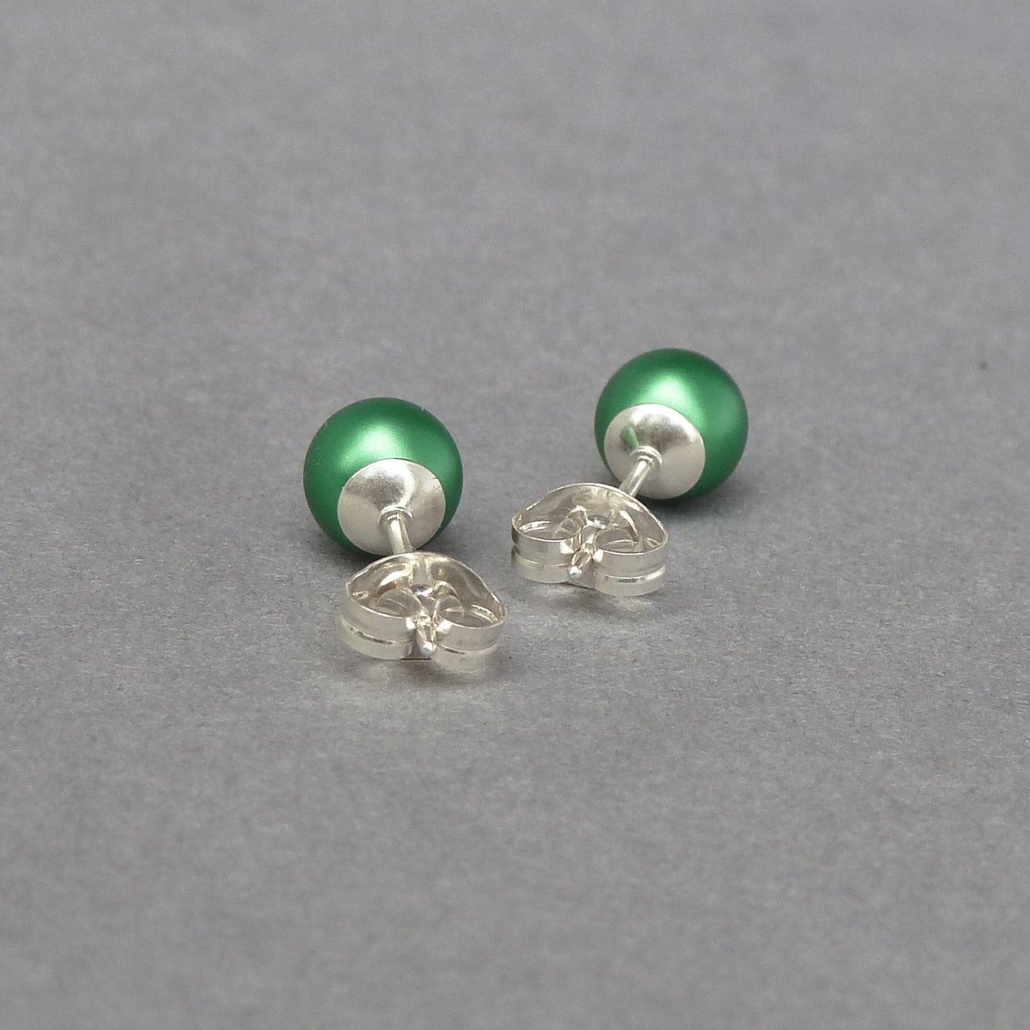 Small green pearl stud earrings