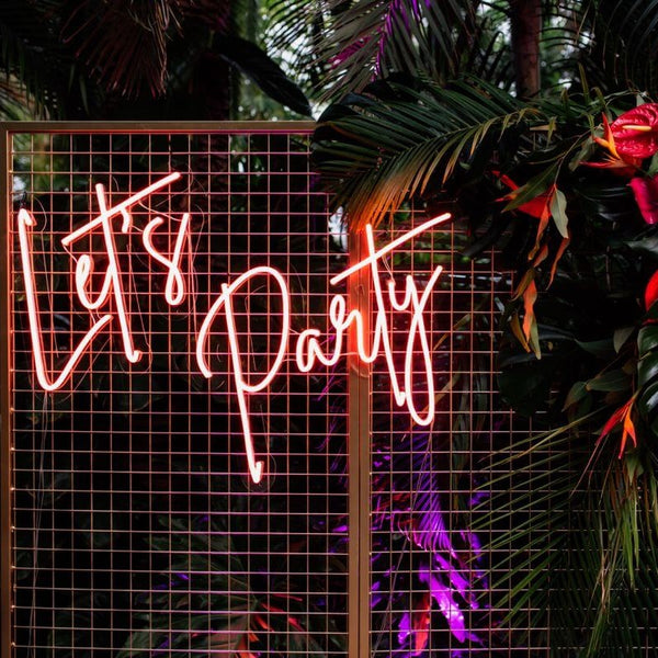 let's party neon sign flower wall