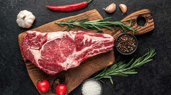 raw-cowboy-beef-steak-stone-background
