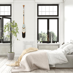 Canoe paddle in black and white bedroom