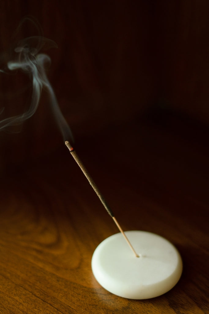 incense stick burning at an angle 