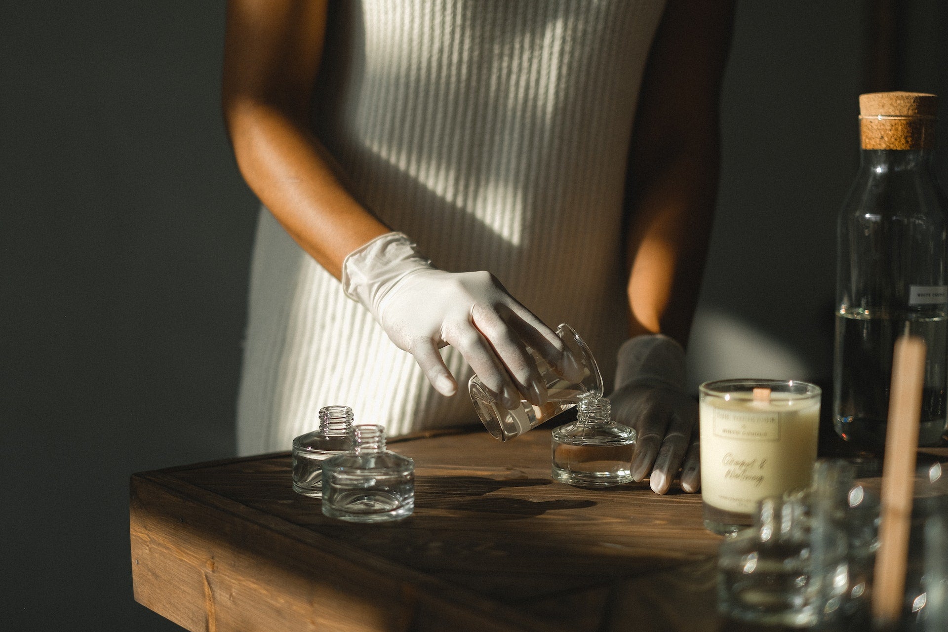 image of a lady mixing chemicals to create perfume