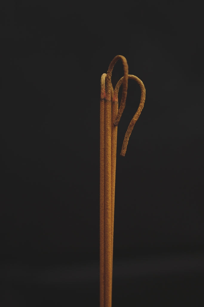 image of incense sticks in dark background