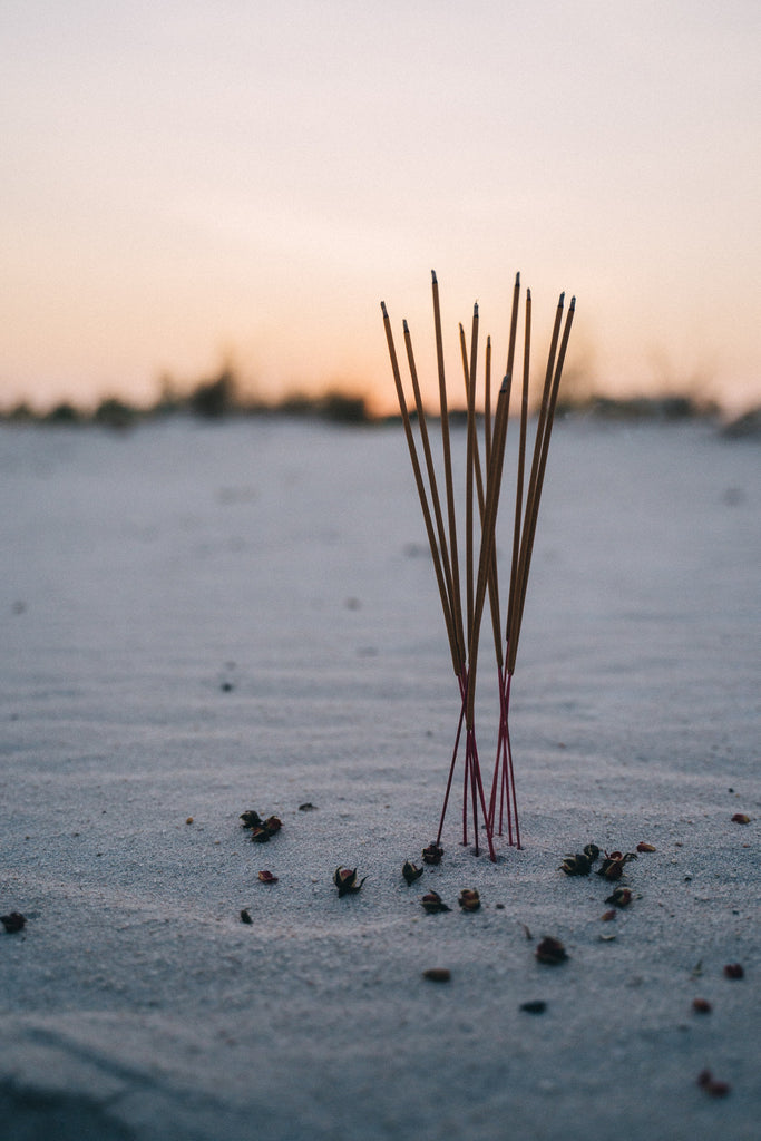image of incense sticks in sand namomonk