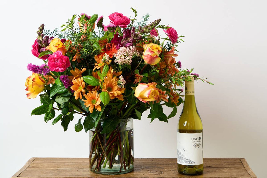 mixed flowers with white wine, stunning gift delivered, loved ones