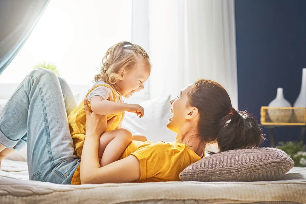 Young mom with daughter playing, smiling, gifts for mother, gifts for her, fabulous flowers