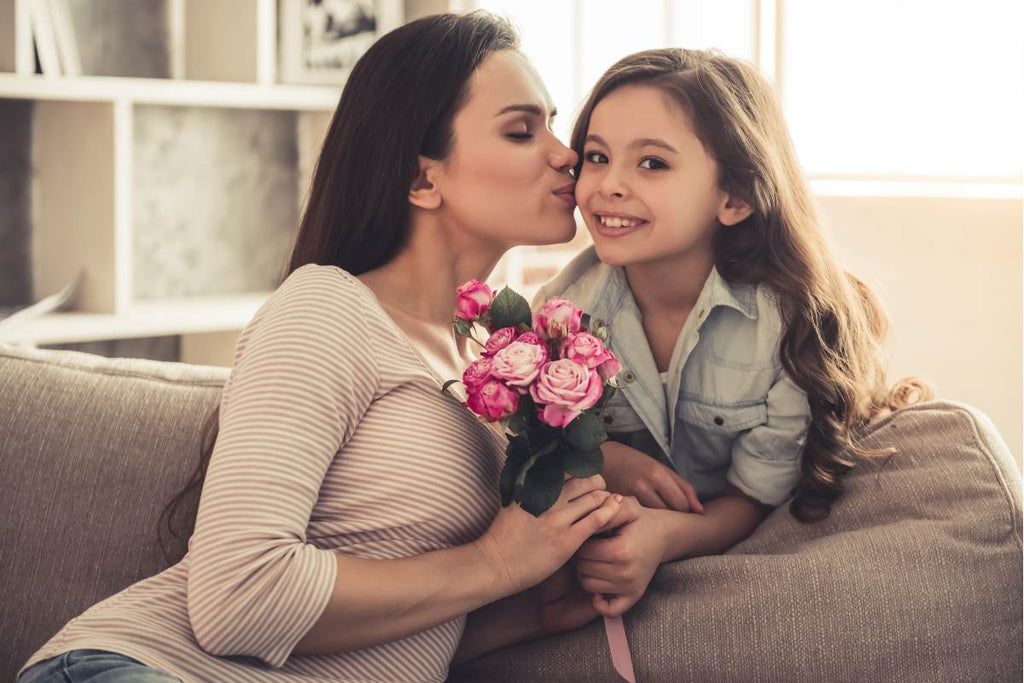 Mom and little daughter with Fabulous Flowers, smiling, happy