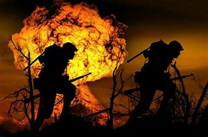 Picture of 2 soldiers in a firefight.