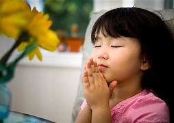 Asia girl praying.