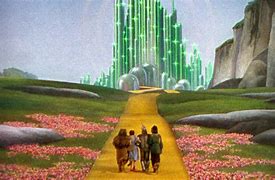 Picture of the principlas of The Wizard of Oz walking toward Emerald City.