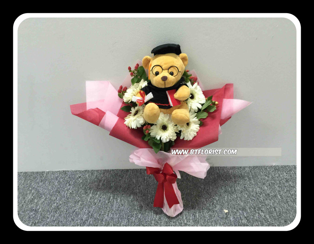 graduation flowers with bear