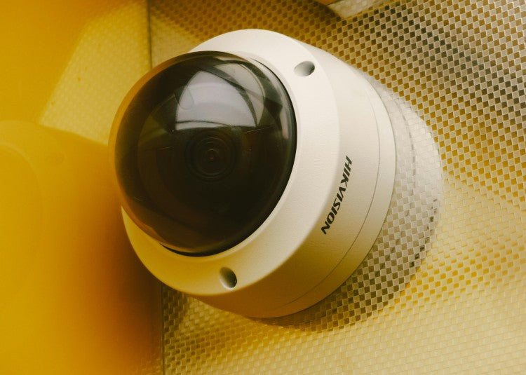 A Hikvision CCTV camera mounted on a wall
