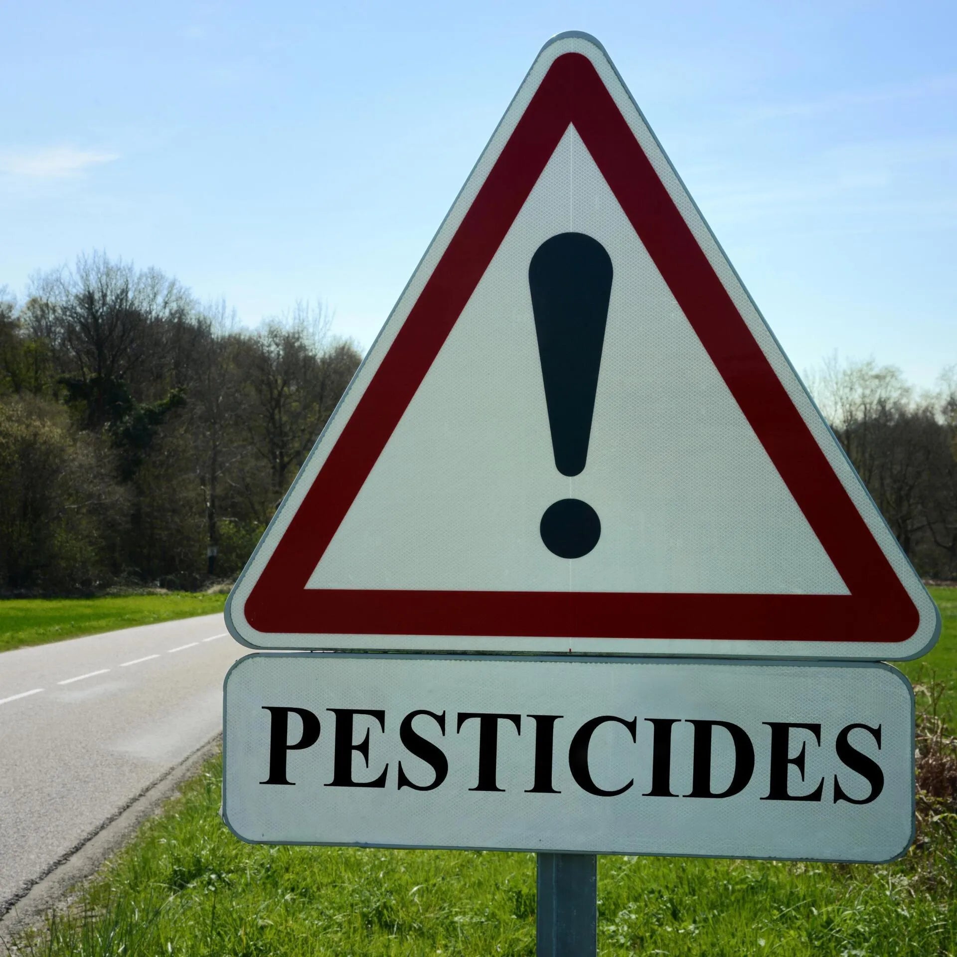road sign warning pesticides in use