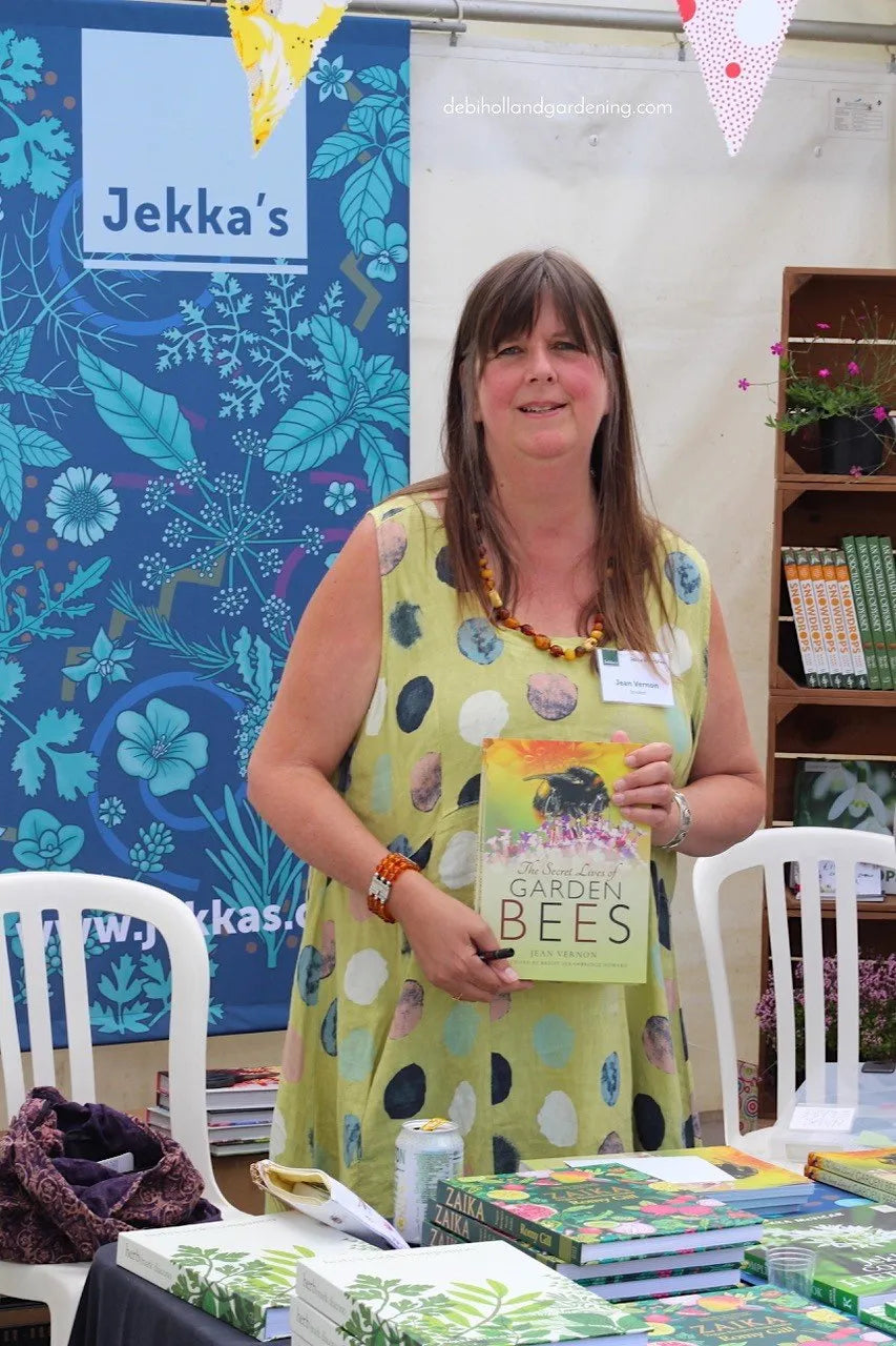 Jean Vernon is an award-winning garden writer and she is shown here holding her garden bees book