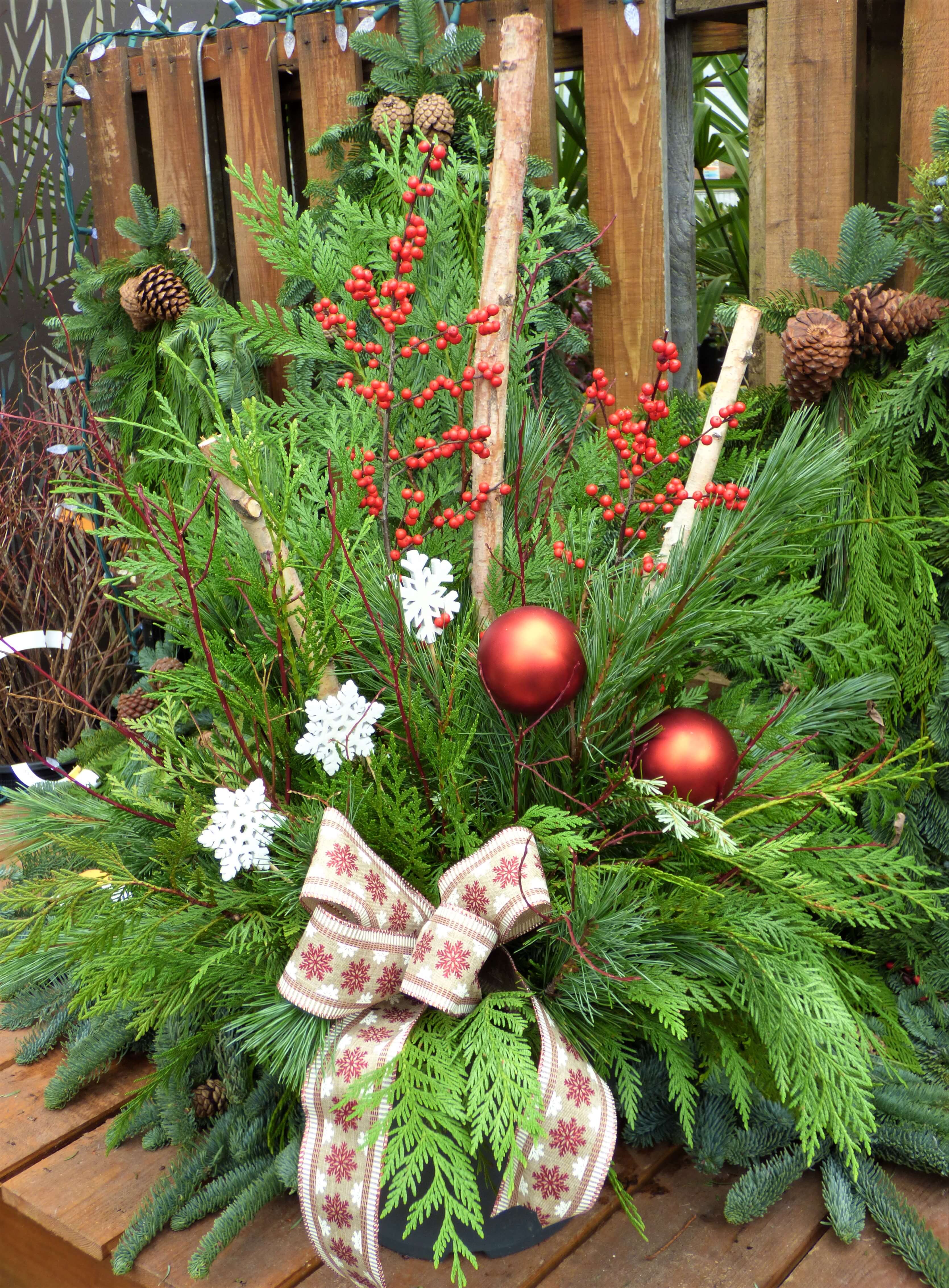Decorated porch pot with red bulbs