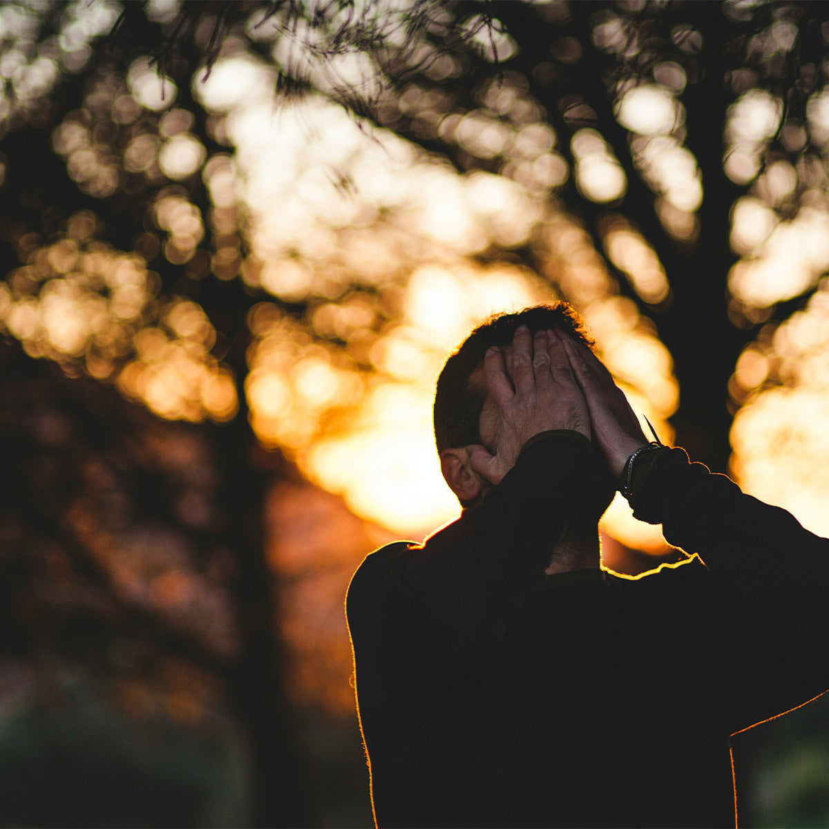 Man with head in hands