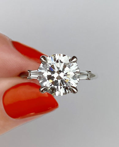 round-and-baguette-three-stone-diamond-ring