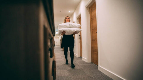 hotel-staff-with-pillows