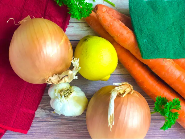 Onions, carrots, lemons, garlic, and rosemary.