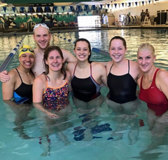 Haley Chura professional triathlete at the swimming pool with a group of fellow swimmers