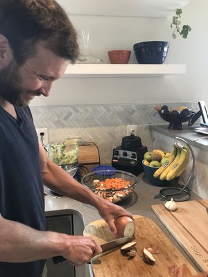 Joe Gambles in the kitchen prepping a plant-based meal