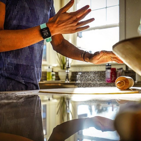 Linsey Corbin in the kitchen rolling homemade pie crust