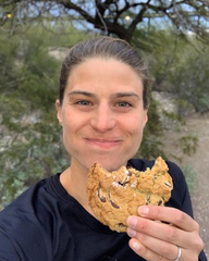 Sarah True professional triathlete enjoying a much deserved cookie