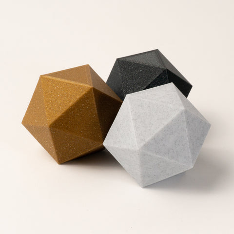 photo of 3 icosahedrons in gold, obsidian, marble