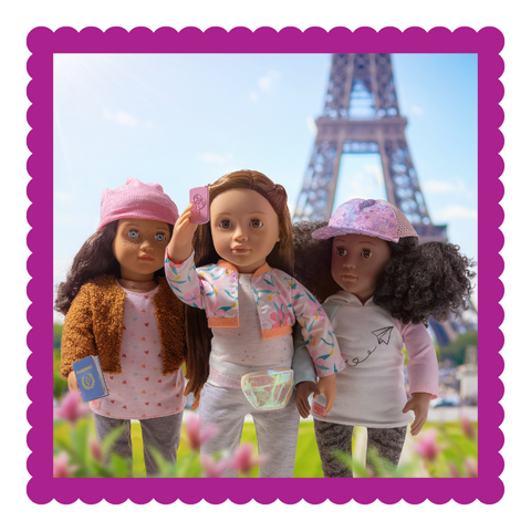 3 dolls in front of the Eiffel Tower
