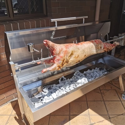 1500 mm BBQ Spit Rotisserie | Spartan Hooded with a whole lamb cooking