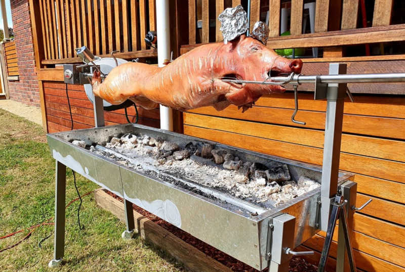 Extendable BBQ Spit Roaster | Flaming Coals with whole pig cooking